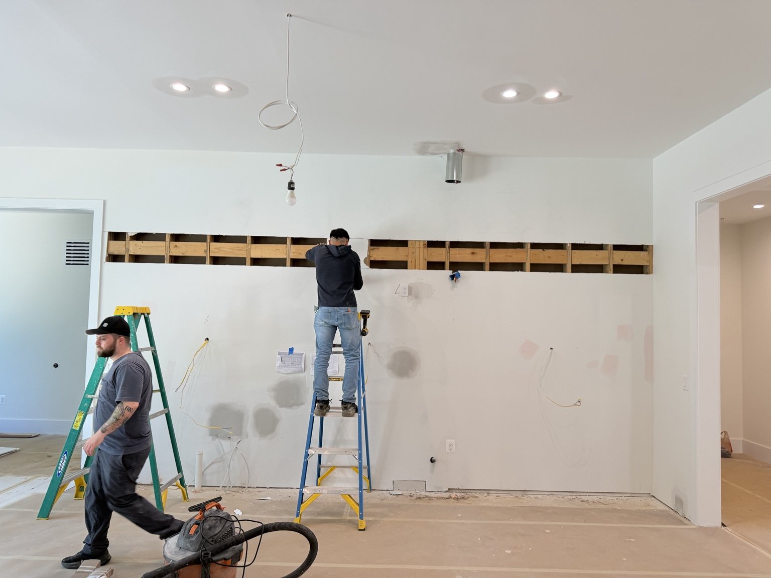Wall opened after drywall to access concealed construction conditions